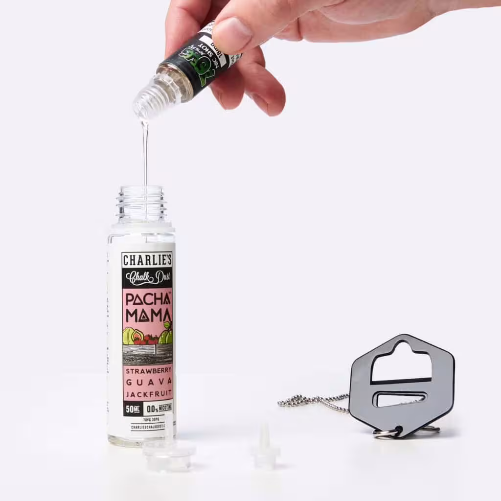 Squeezing a nic shot into a shortfill bottle to mix a 0mg bottle into a 3mg bottle